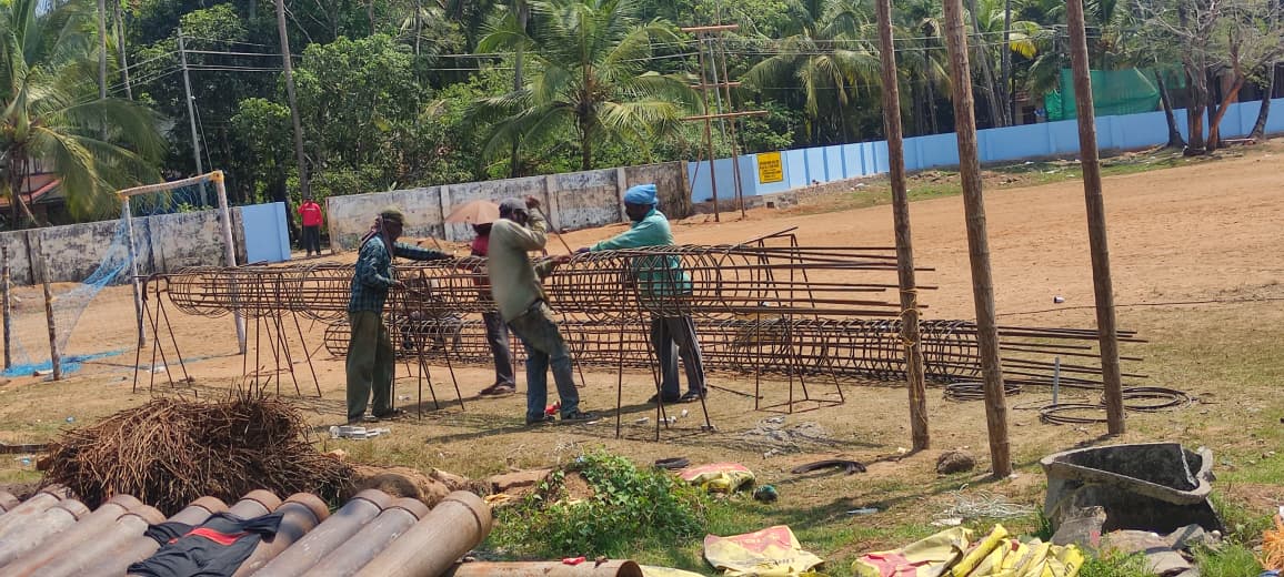 Workers preparing pile reinforcement cage